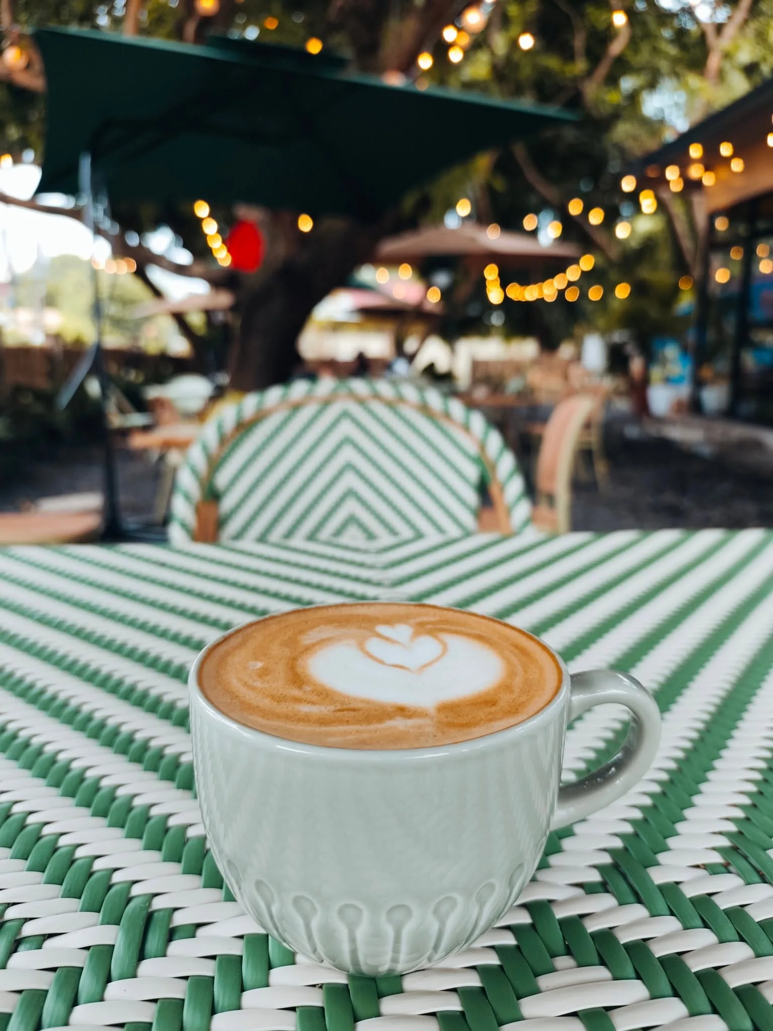 Cappuccino on a patterned garden table